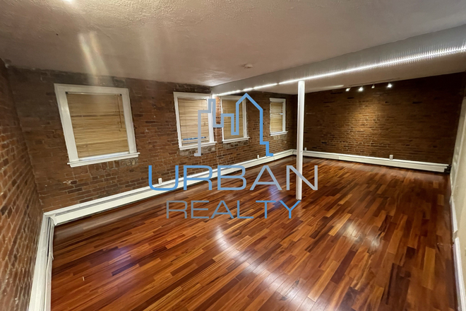 Living Room - ***MOVE IN AUGUST 15/2025***  LOFT STYLE 2 BED APARTMENT - OPEN KITCHEN - HEAT & HOT WATER INCLUDED