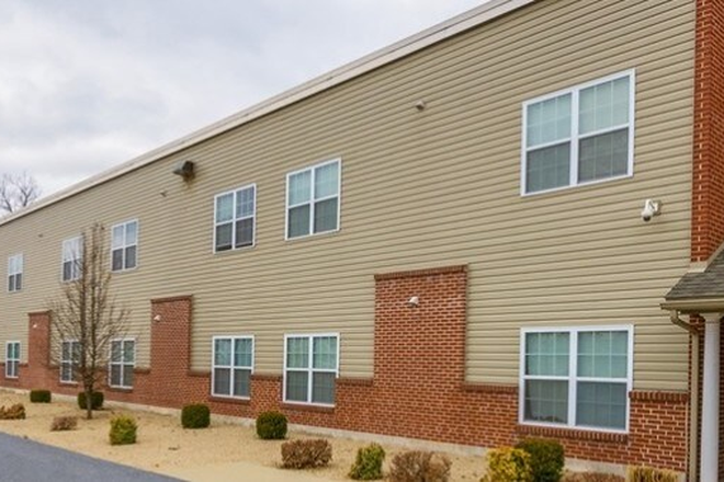 The outside of the apartment. - School House Lofts Off Campus Housing