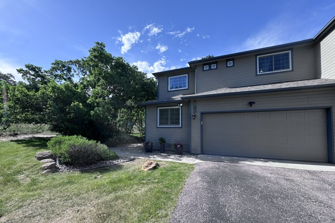 front of house and driveway - Peaceful Furnished Room with 3-Piece Bath Near UCCS – Quiet Academic Home, Tree Views & Trails