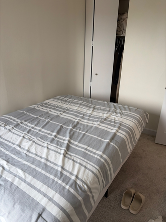 Small bedroom with a window and closet (there’s additional storage space in the entrance hall and corridor) - Unit NE3 Apartments