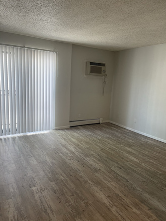 Living Room - 2BR Just 5 Blocks from Campus - Free Internet Apartments