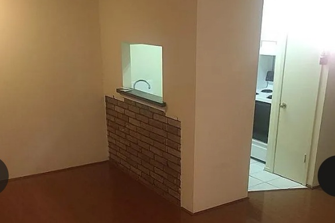 Living area view to kitchen/dining nook - Clean and Quaint - One-bedroom (Montrose/Upper Kirby/Museum district) Apartments
