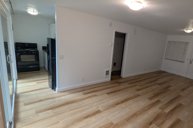 Kitchen, Living Room - Charming 1-Bedroom 1-Bath Apartment with patio/deck in Prime Location