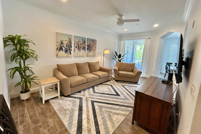 Living Room (main level) - Fully Furnished Condo w/ Two Masters Suites