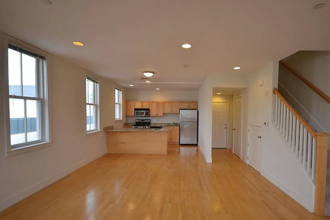 Downstairs, kitchen/dining area - 2 bedroom, 2.5 bath, corner apartment, lease re-let through Aug 2026 in Kendall Square