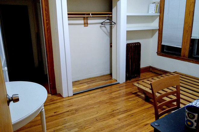 Bedroom w/ own entrance to building's hallway. Excellent closet space. (It extends behind the wall w/ shelves you can see.) - ROOMMATE/SUBLET (asap)  $1000 including gas, hotwater, internet, and electricity (up to $60) Apartments
