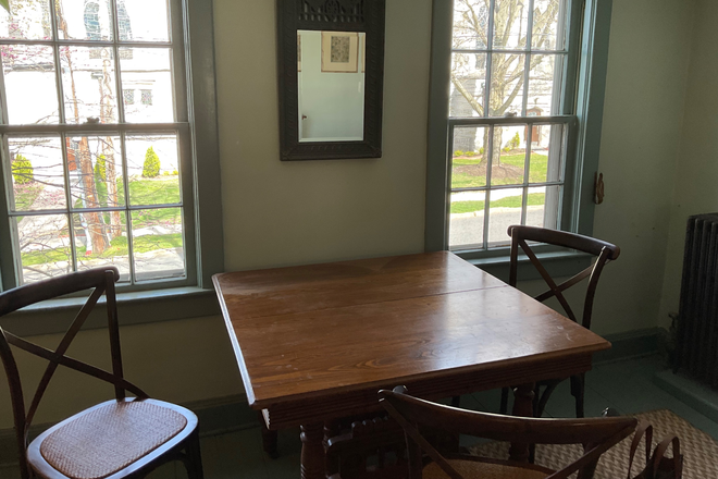 Dining table in room with fireplace . - Furnished 1BR apt-Moore St-Princeton
