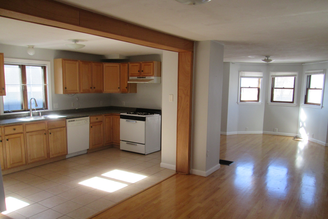 Kitchen and a bit of living room showing open floor plan - Single Family Off Wickenden Awaits