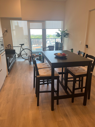Living-Dining room - Roommate wanted to share a furnished 2 bed 1 bath brand new condo , $1190/mt, incl utilities & WiFi