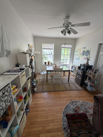 Wonderful living room with big food pantry and dining table and drink fridge - 643 Library Pl, Apartment 1