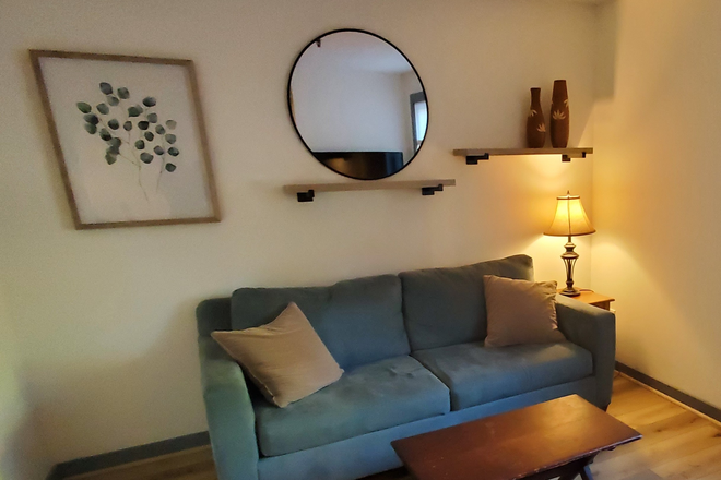 Living room with entertainment set included - 337 College street Unit 5 Apartments