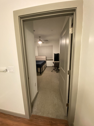 bathroom inside unit door - 14SixtyFive Apartments