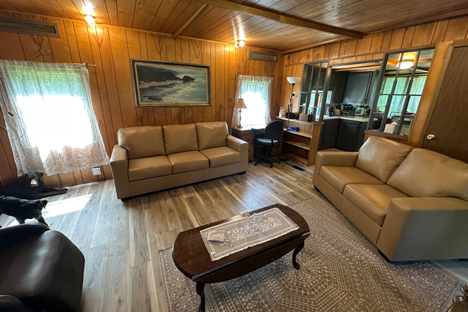 Living room - Bedroom on beautiful property with large 1/2 acre lawn located less than 3 minutes from campus