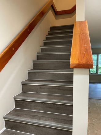 Interior staircase connecting the first and second floors - 2BR/2BA Mill Creek condo, walking distance to campus