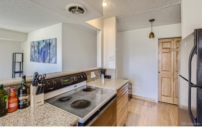 Kitchen opens to the living room and dining room - LOCATION! $1500/month -  2BD/2BA Corner Condo across from CU. ONLY 1 BDR FOR RENT