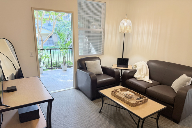 Living Room - Spacious Single-Occupancy Apartment with Private Patio & In-Unit Laundry