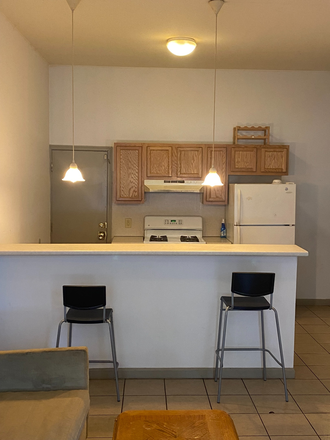 Bar separating kitchen and living room - 2/3 Bedroom, 1 Bath, Within Temple Patrol, In-Unit Washer/Dryer, Central Air, Big Rooms, Back Yard Apartments