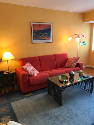 Seating area. - Large cheery studio with EXTRA WORK SPACE 1 block from Metro Condo