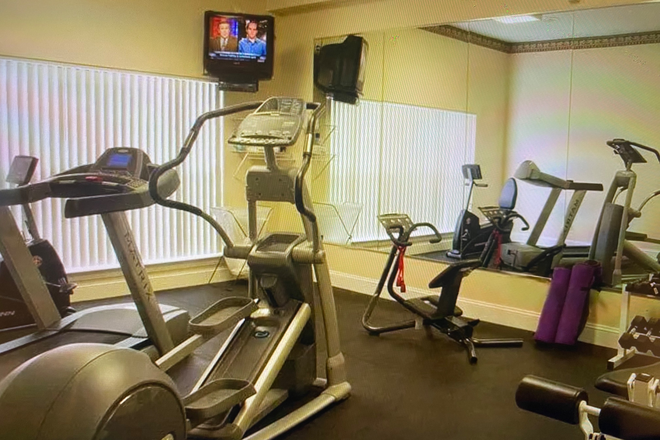 Exercise room , part of pool and party room - Knollwood 2 bedroom condo (plus loft) directly across from VCOM and CRC.