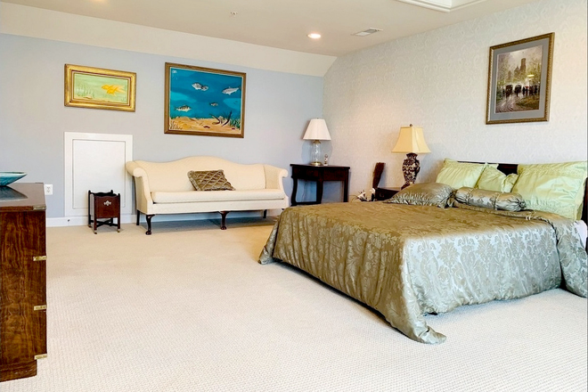 Master Bedroom : Includes private bathroom and an oversized walk-in closet. Furnishings are as shown in the photos. Monthly Rent: $1,400. - GBS Luxury master bedroom with private bathroom and balcony, and parking space, $1400/month.
