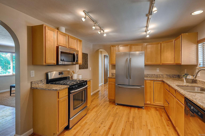 large well-equiped kitchen - Two bedrooms available August 1! Spacious four bedroom home steps away from Claver Hall...