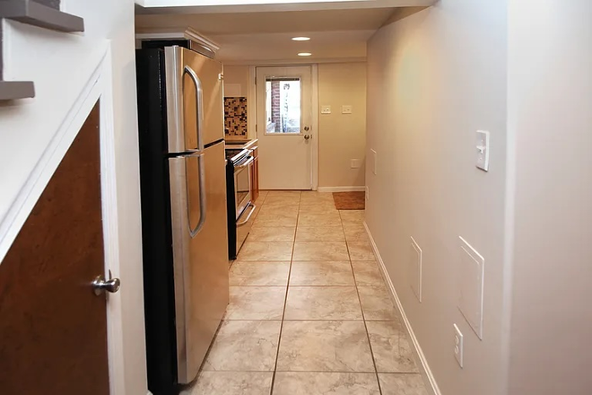 Entrance and Kitchen - 1 BDM + 1 Den Apartment in Quiet Metro-Accessible Neighborhood