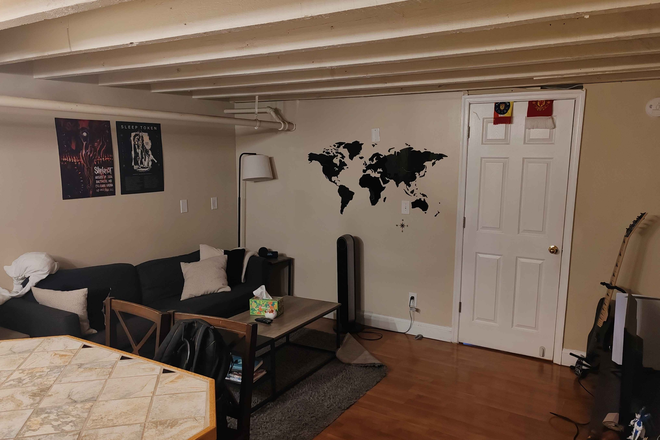 Living room, connected to kitchen - 3020A Guilford Ave, One Bedroom Apartment for Sublease