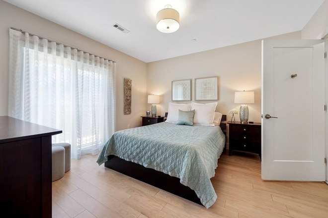 Master Bedroom w/Juliet Balcony - All the Perks! Sunny 2BR/2BA Condo with In-Unit Washer/Dryer, Covered Parking & Near Porter Sq!