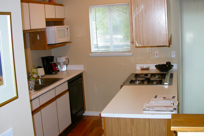 Kitchen cabinets, countertops & gas range in photo are being replaced. - Clean Spacious 3 Bedroom, 4 Bath Boulder Townhome
