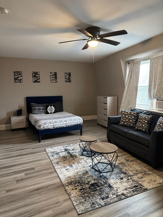 Bedroom, all furniture included - Walk to campus from this studio! Apartments