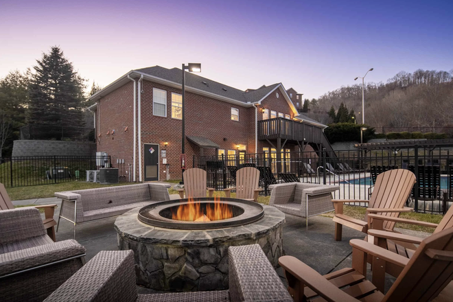 Outside fireplace for communal and personal events - Mountaineer Village Apartments