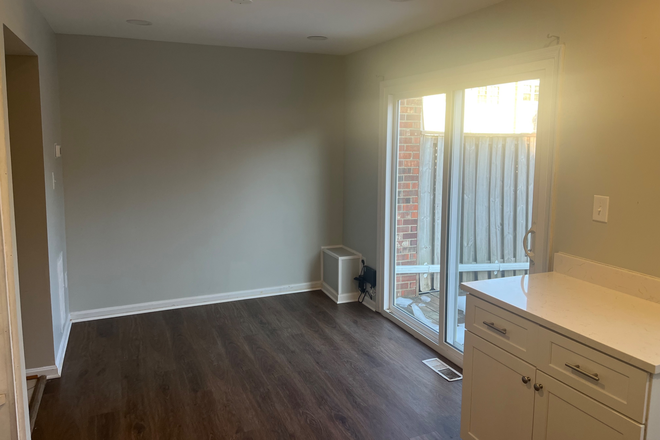 Kitchen and eating area, patio door - Great value : priced right! and great location close to GMU, groceries, pharmacy, and restaurants Townhome