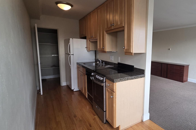 Kitchen and Large Pantry/Storage Room - Amazing Location -- Spacious Studio in Secure West Wash Park Bldg Condo