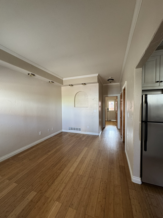 Living room - Charming 2-Bed in Curtis Park with Modern Upgrades and Prime Location