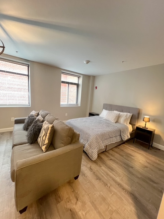 Bedroom view - 109 W Lexington Apartments, modern, downtown, great transportation options