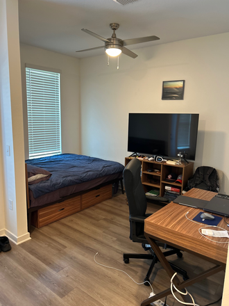 Bed and desk area (TV included) - The Accolade at Collegiate Village West Apartments
