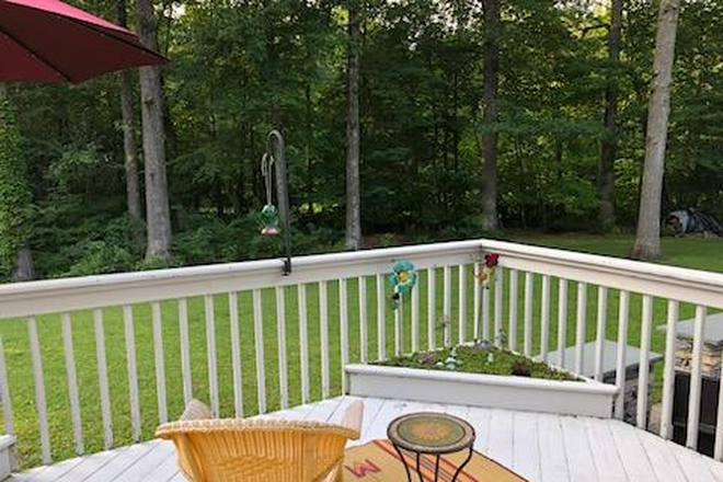 Tenants deck looks down at patio. - 1/2 Duplex Available Rental