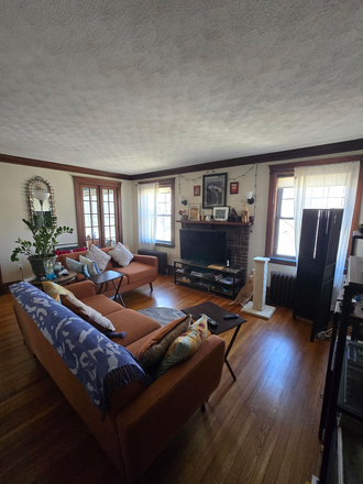 Living room with a patio - Summer Sublet- Furnished Bedroom in Belmont (Easy Access to Brandeis & Harvard SQ/Red Line) House