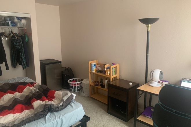 Bedroom, with my stuff - The Village at Chandler Crossings Apartments