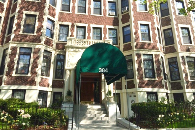 Main Entrance to 384 Riverway, Intercom Access with Master Key to entrance and Foyer - Semi-furnished 2-bedroom condo furnished living, dining , kitchen. Tenant supplies beds, mat