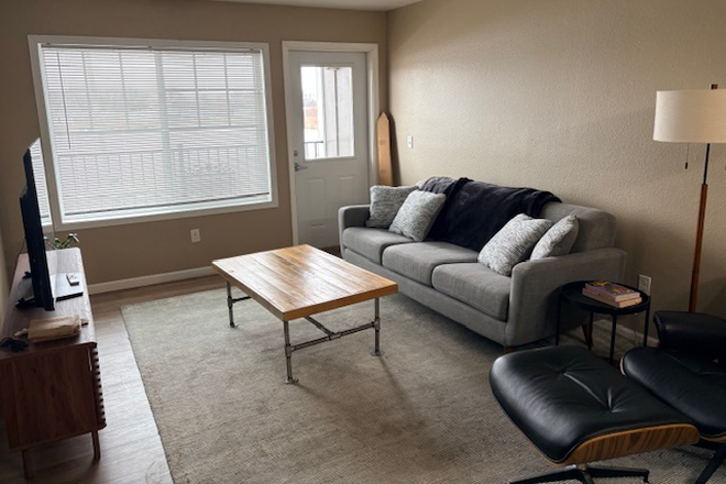 Living room and door to balcony - The Quarters Apartments