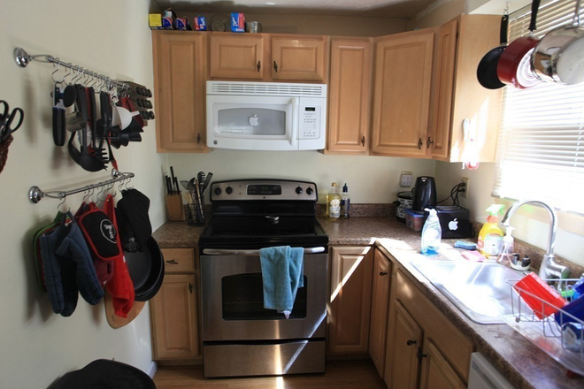 . - Massive four level 1857 sqft corner townhouse on Ashford Street with two private balconies, laundry