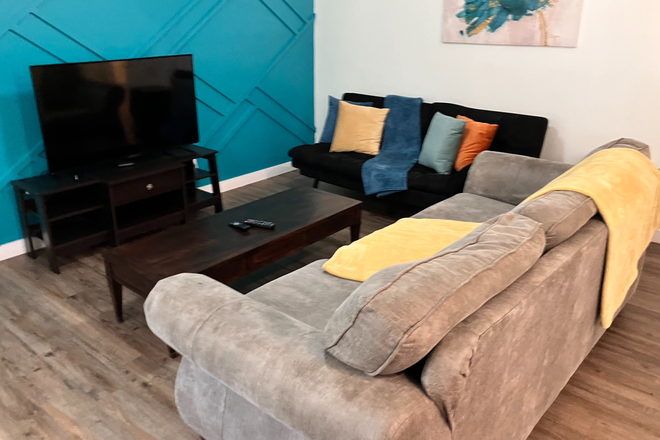 Living Room - Private, furnished room available. Live with grad students.