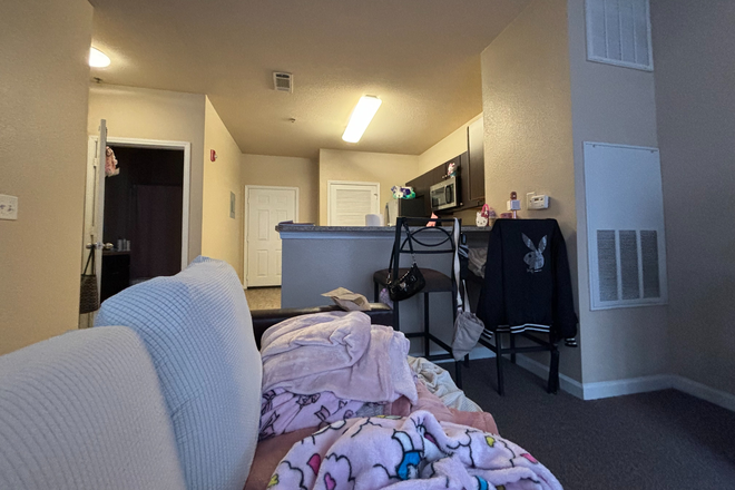 View from the living room couch, showing the kitchen island. - Hello! I am looking to sublease my studio apartment, I graduate in December. Rent is $949 a month.