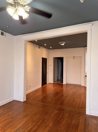 Living Room - Spacious Renovated 3BR near UIC · In-Unit Laundry · Steps to Pink Line Apartments