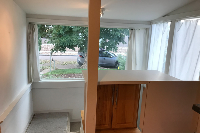 Desk and stairwell - Architect-Remodeled 2 Bed Duplex – 2 Min Walk to Regis University Duplex