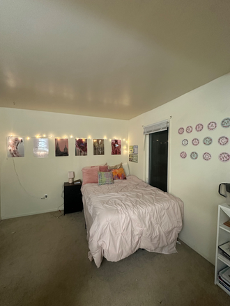 Bed and bedside table (preview of the library organiser on the side) - Duplex apartment- will have master room with attached bathroom and walk in closet!