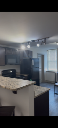 Kitchen - The Academy on Charles Street Apartments