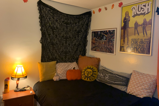 Bedroom bed and side table - University Highlands Apartments