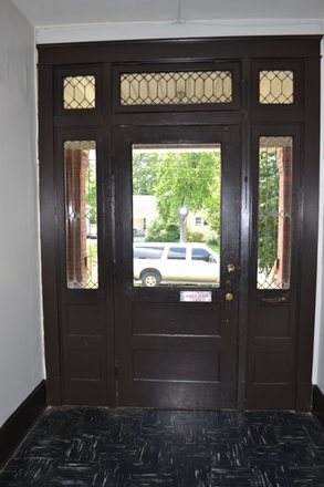 Front door of the building from the inside - One Bed, One Bath Apartment